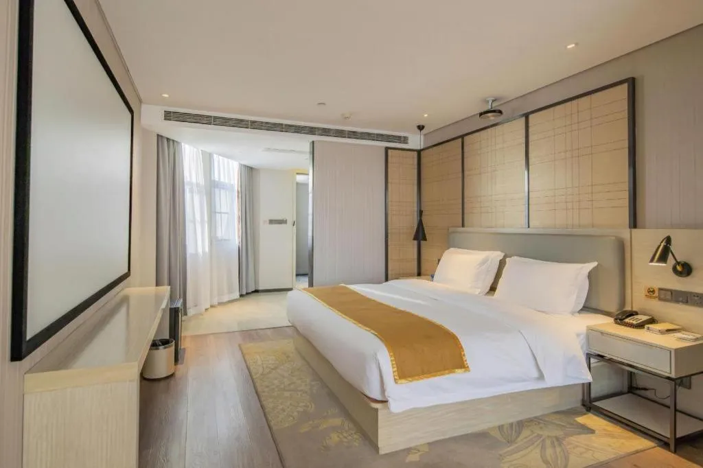 Bed in Echarm Hotel Changsha Guihua Park Metro Station