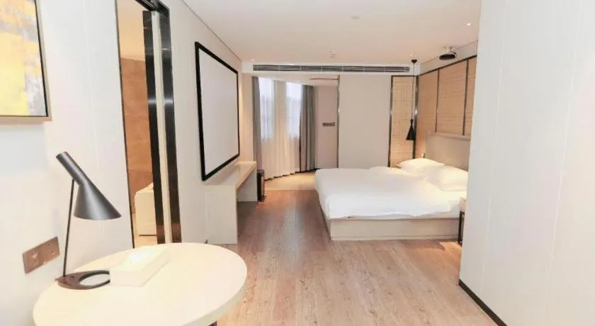 Bed in Echarm Hotel Changsha Guihua Park Metro Station