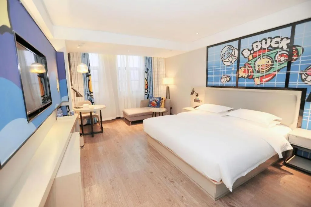 Bed in Echarm Hotel Changsha Guihua Park Metro Station