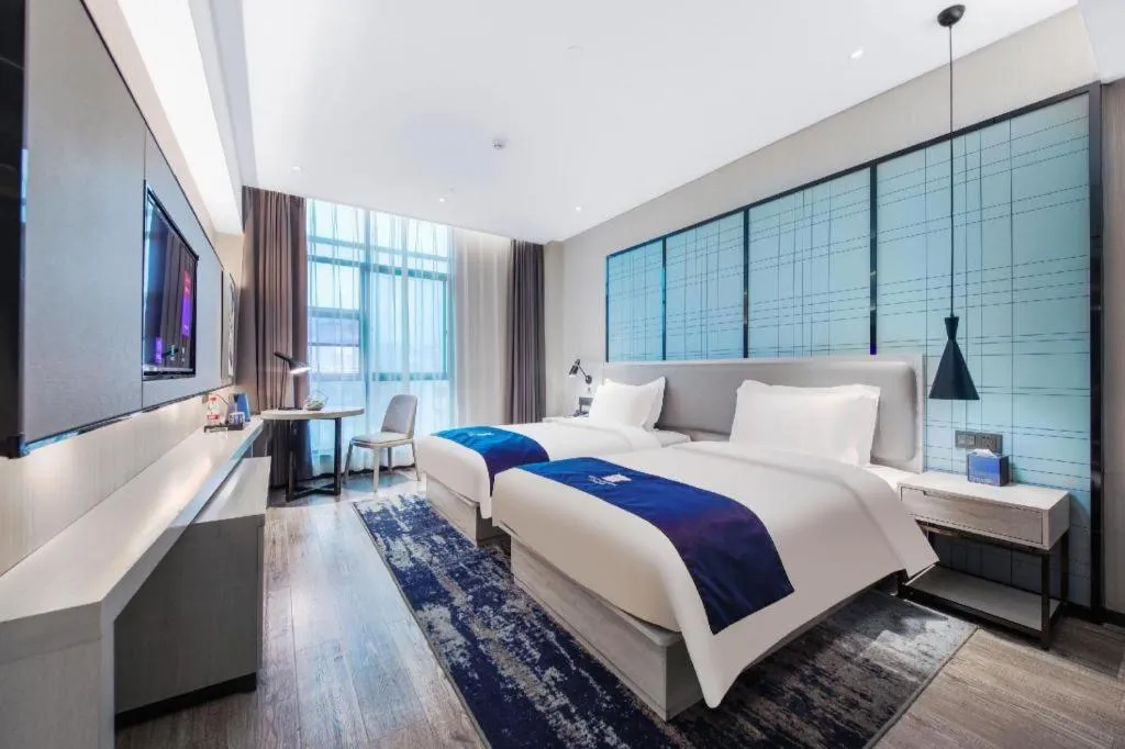 Bed in Echarm Hotel Xinyu Railway Station Baoshi Park