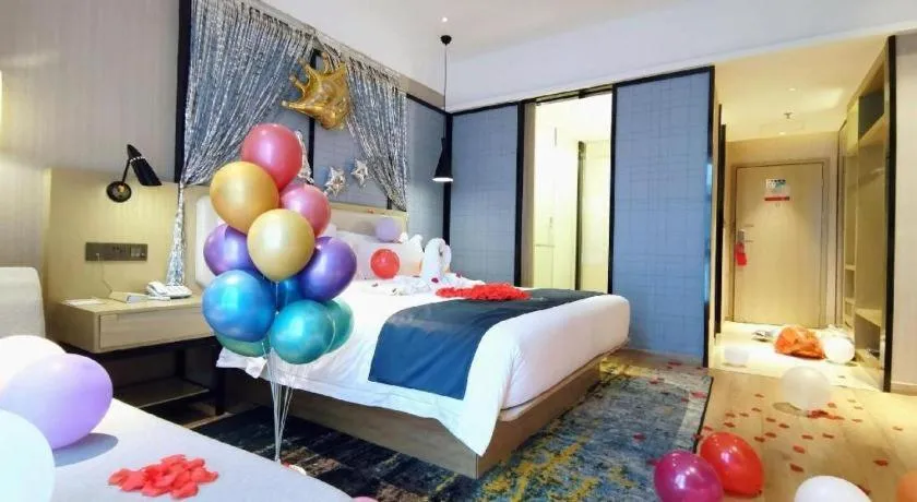 Bed in Echarm Hotel Xinyu Railway Station Baoshi Park