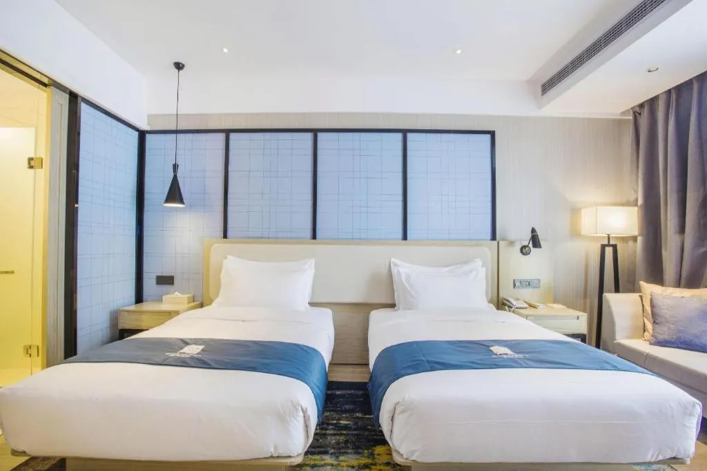 Bed in Echarm Hotel Xinyu Railway Station Baoshi Park