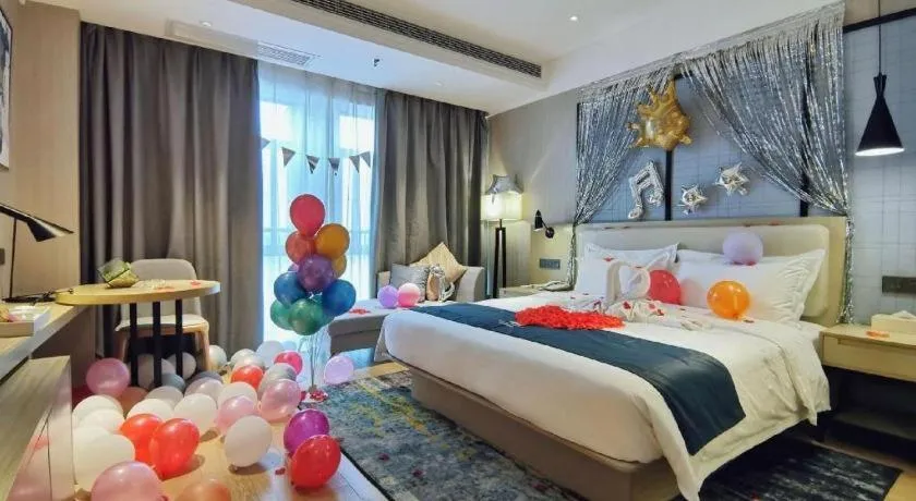 Bed in Echarm Hotel Xinyu Railway Station Baoshi Park