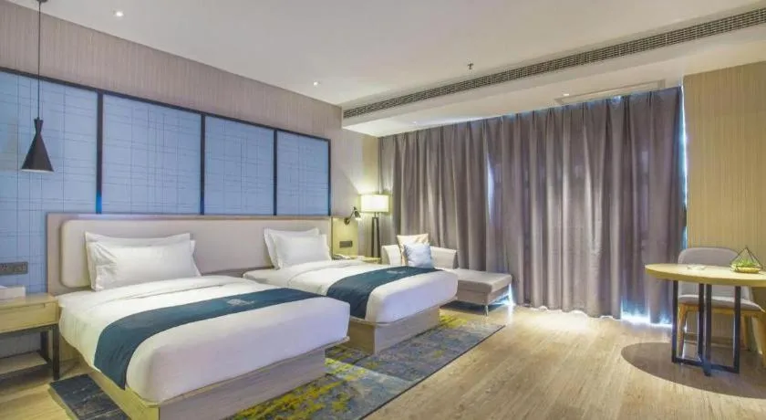 Bed in Echarm Hotel Xinyu Railway Station Baoshi Park