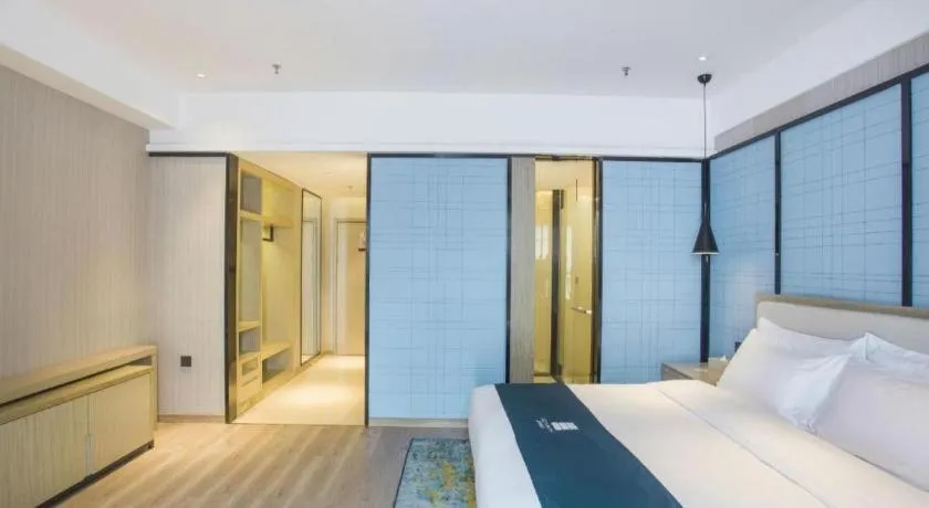 Bed in Echarm Hotel Xinyu Railway Station Baoshi Park