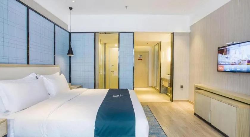 Bed in Echarm Hotel Xinyu Railway Station Baoshi Park