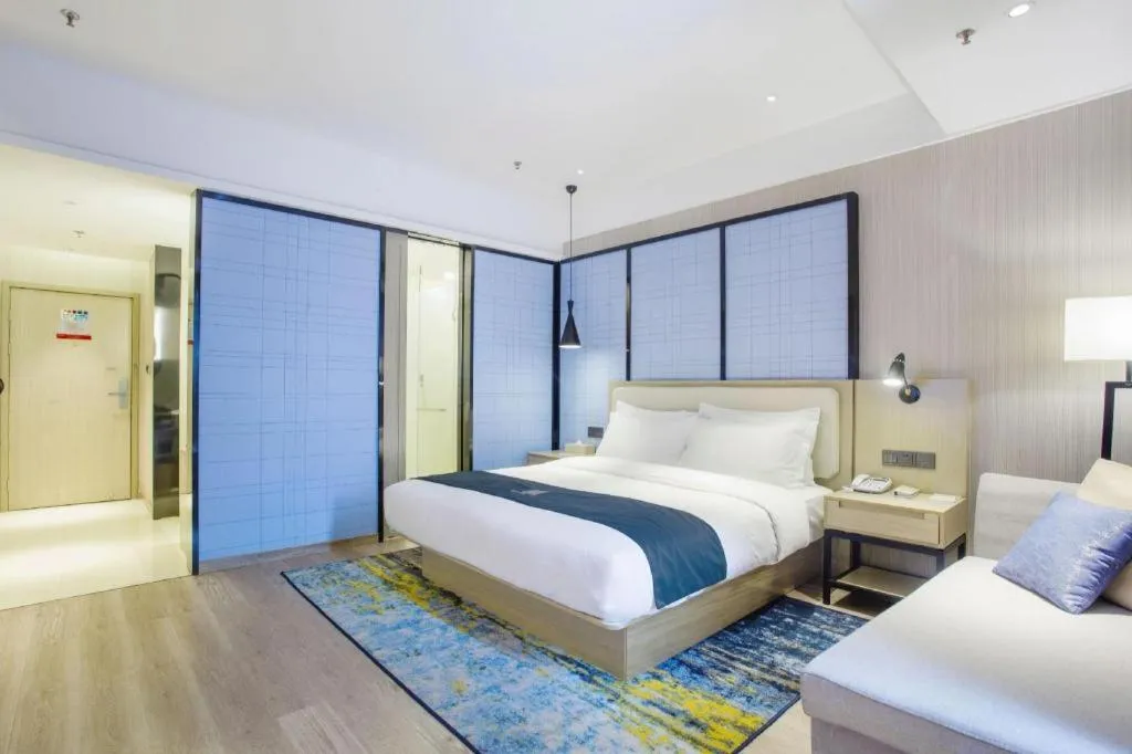 Bed in Echarm Hotel Xinyu Railway Station Baoshi Park