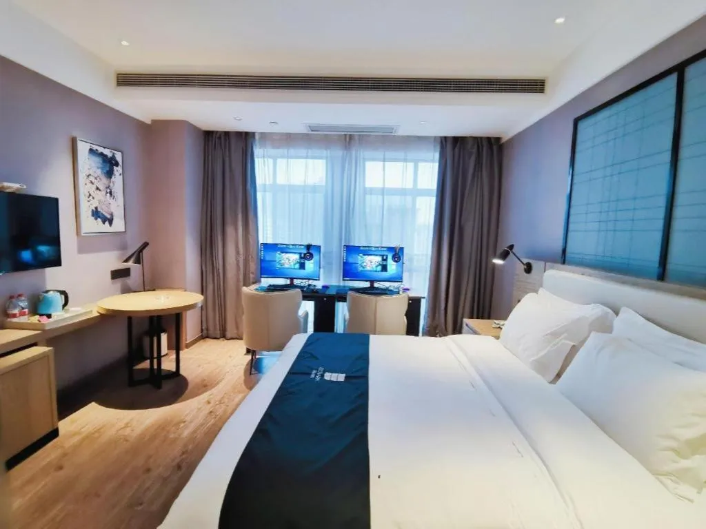 Bed in Echarm Hotel Xinyu Railway Station Baoshi Park