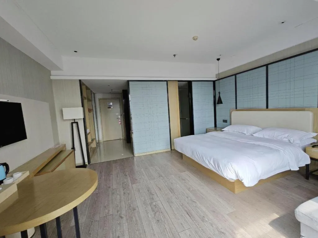 Bed in Echarm Hotel Xinyu Railway Station Baoshi Park