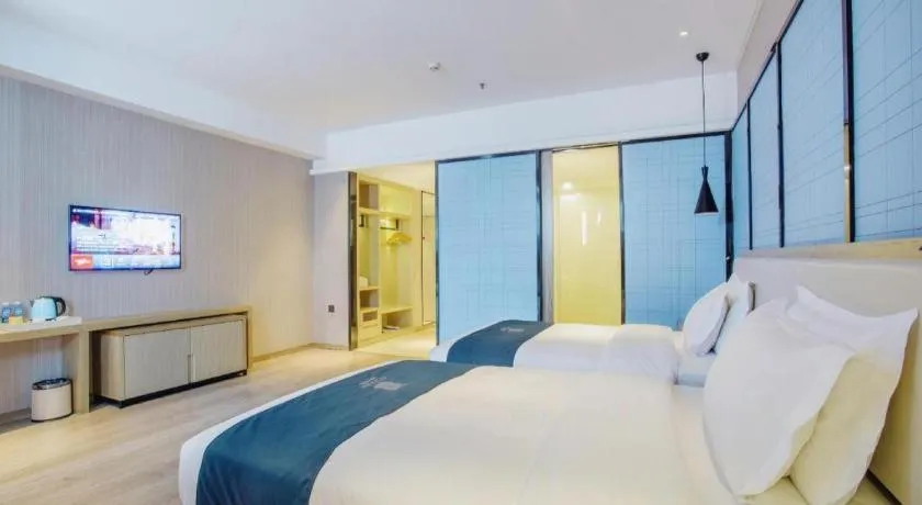 Bed in Echarm Hotel Xinyu Railway Station Baoshi Park