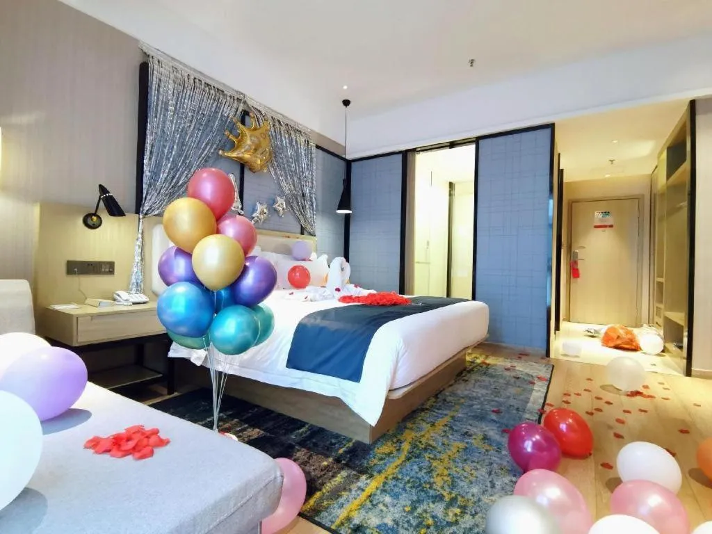 Bed in Echarm Hotel Xinyu Railway Station Baoshi Park