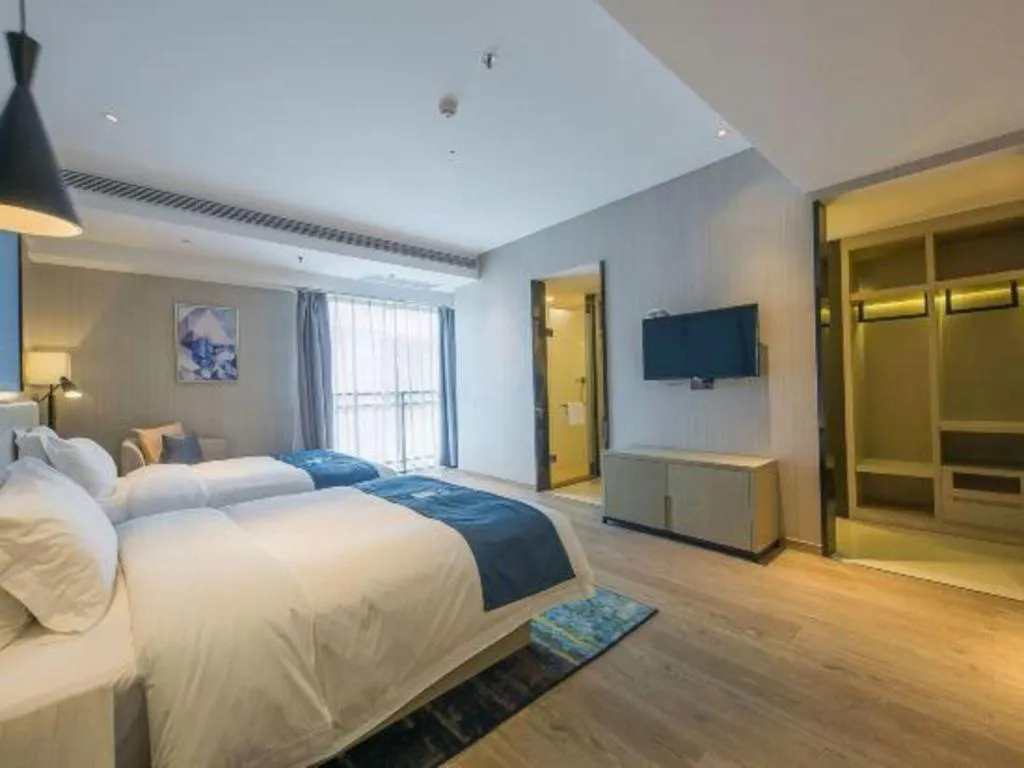 Bed in Echarm Hotel Xinyu Railway Station Baoshi Park