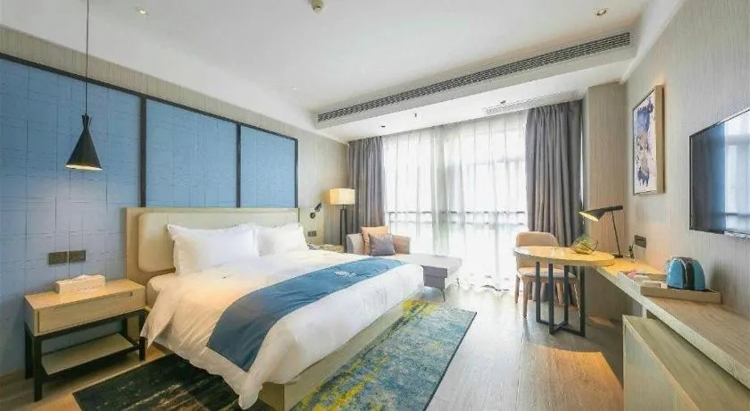 Bed in Echarm Hotel Xinyu Railway Station Baoshi Park