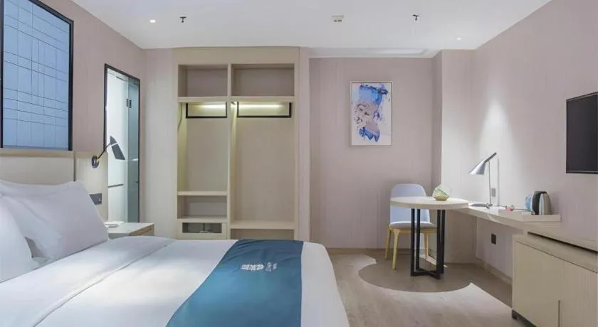 Bed in Echarm Hotel Xinyu Railway Station Baoshi Park