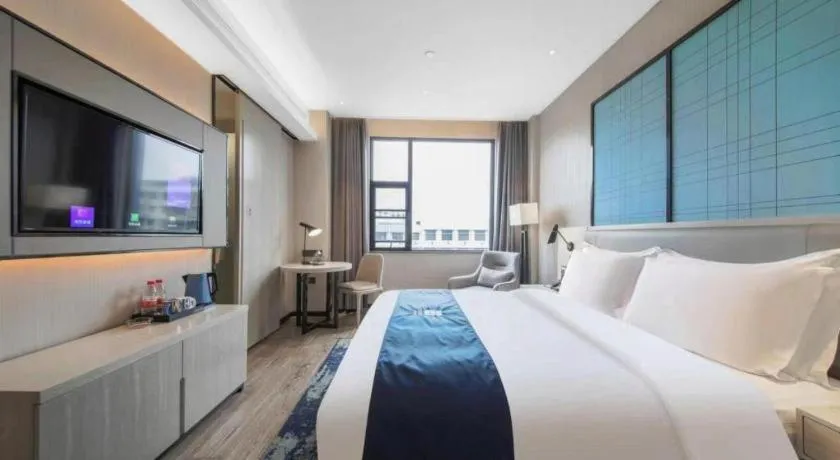 Bed in Echarm Hotel Xinyu Railway Station Baoshi Park