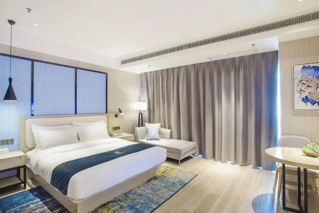 Bed in Echarm Hotel Xinyu Railway Station Baoshi Park