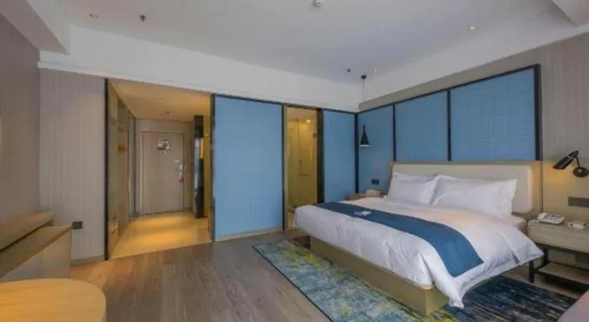 Bed in Echarm Hotel Xinyu Railway Station Baoshi Park