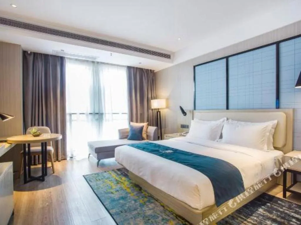 Bed in Echarm Hotel Xinyu Railway Station Baoshi Park