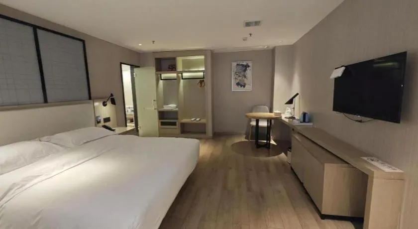 Bed in Echarm Hotel Xinyu Railway Station Baoshi Park