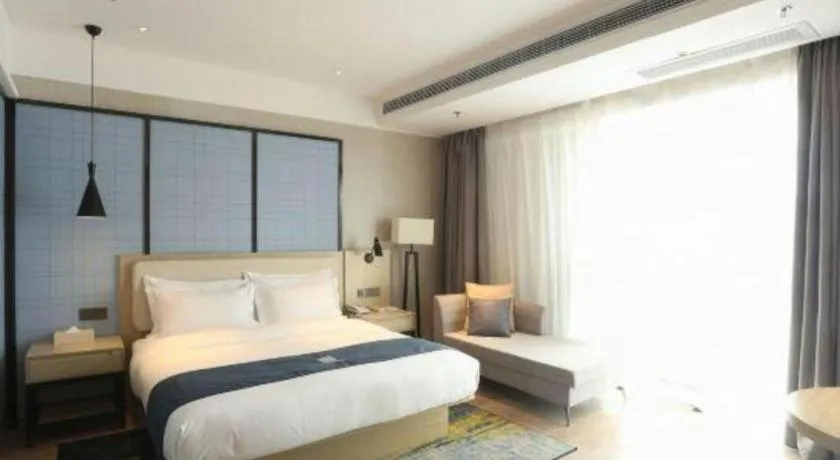 Bed in Echarm Hotel Xinyu Railway Station Baoshi Park