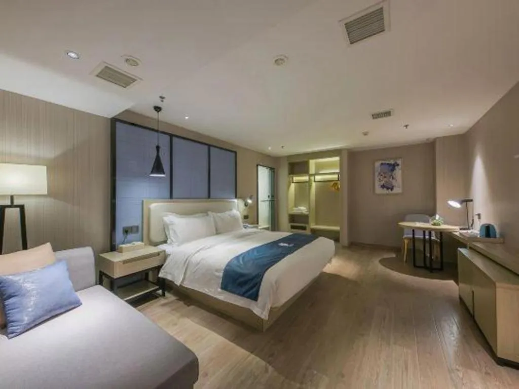 Bed in Echarm Hotel Xinyu Railway Station Baoshi Park