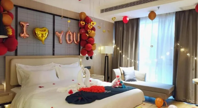 Bed in Echarm Hotel Xinyu Railway Station Baoshi Park