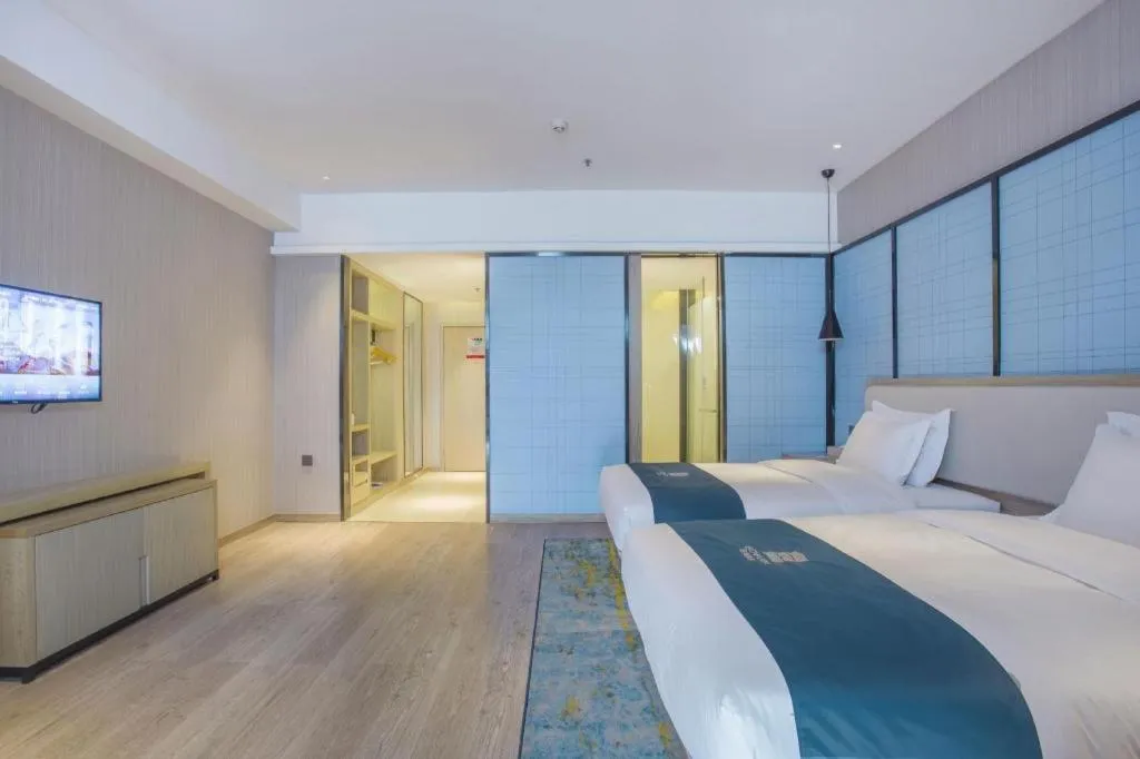 Bed in Echarm Hotel Xinyu Railway Station Baoshi Park