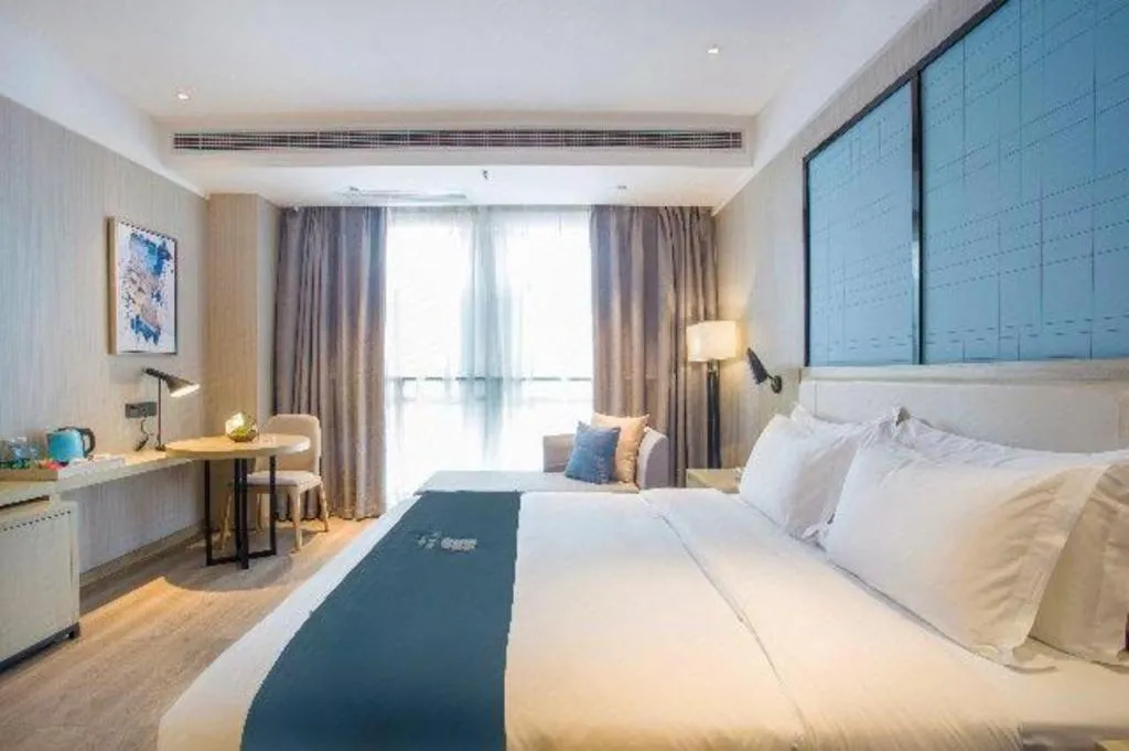 Bed in Echarm Hotel Xinyu Railway Station Baoshi Park