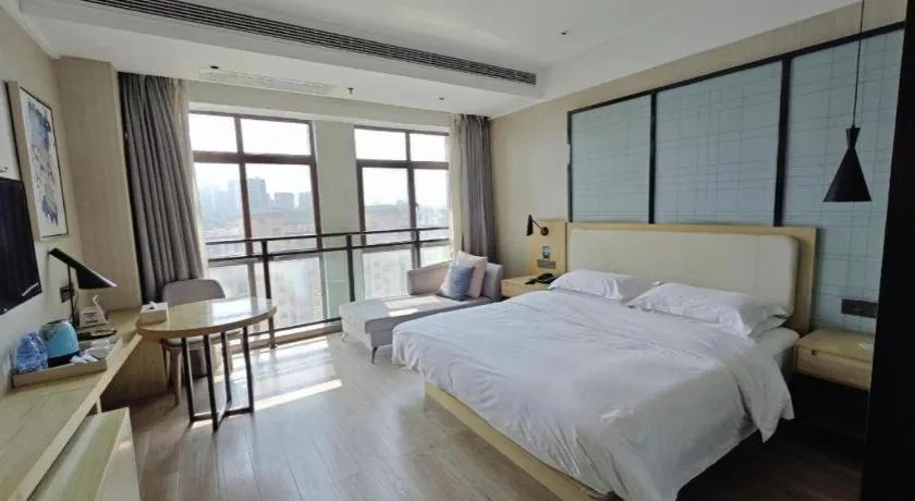 Bed in Echarm Hotel Xinyu Railway Station Baoshi Park