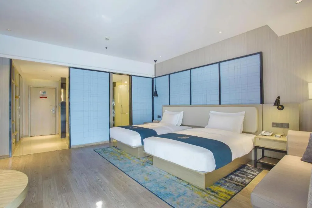 Bed in Echarm Hotel Xinyu Railway Station Baoshi Park