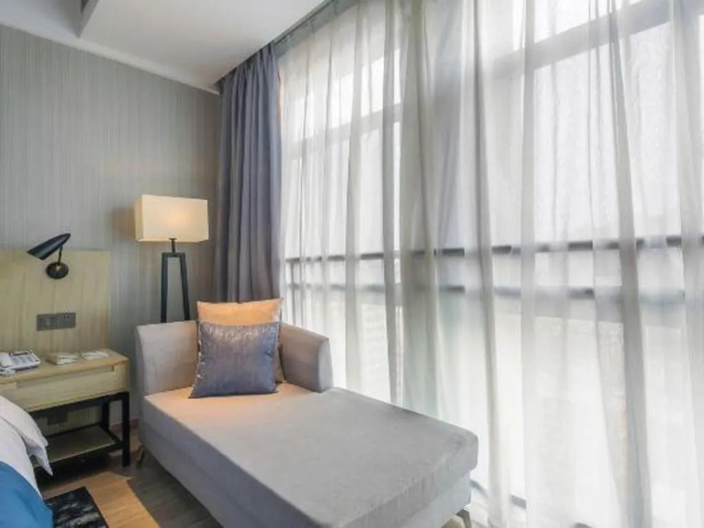 Bed in Echarm Hotel Xinyu Railway Station Baoshi Park