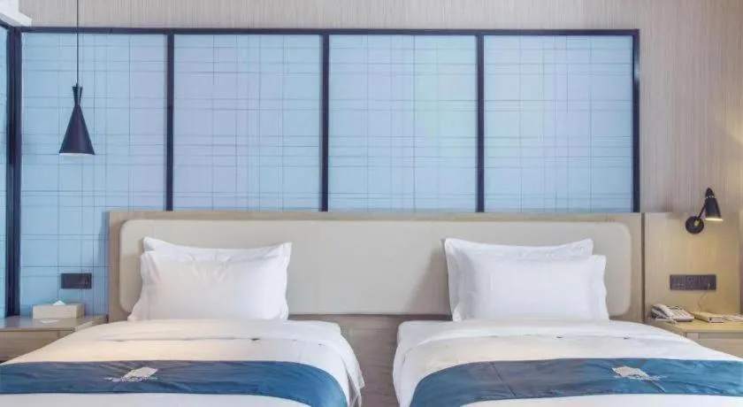 Bed in Echarm Hotel Xinyu Railway Station Baoshi Park