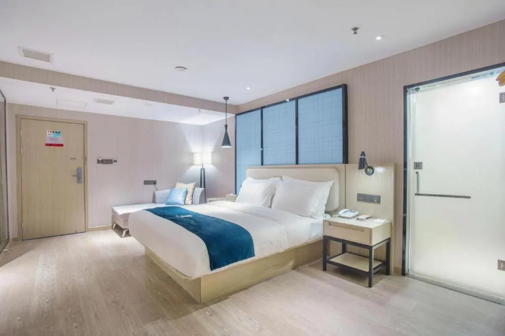 Bed in Echarm Hotel Xinyu Railway Station Baoshi Park