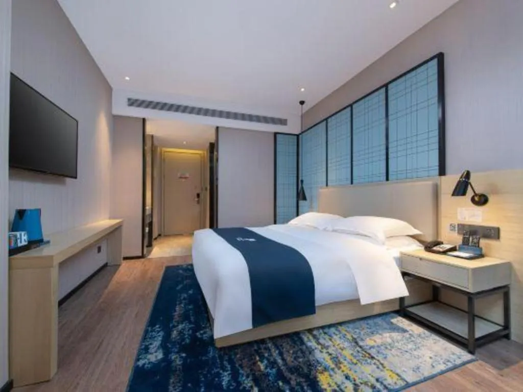 Bed in Echarm Hotel Xinyu Railway Station Baoshi Park