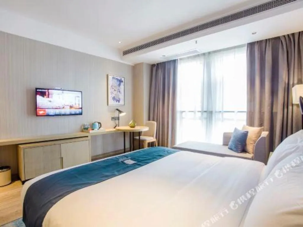 Bed in Echarm Hotel Xinyu Railway Station Baoshi Park