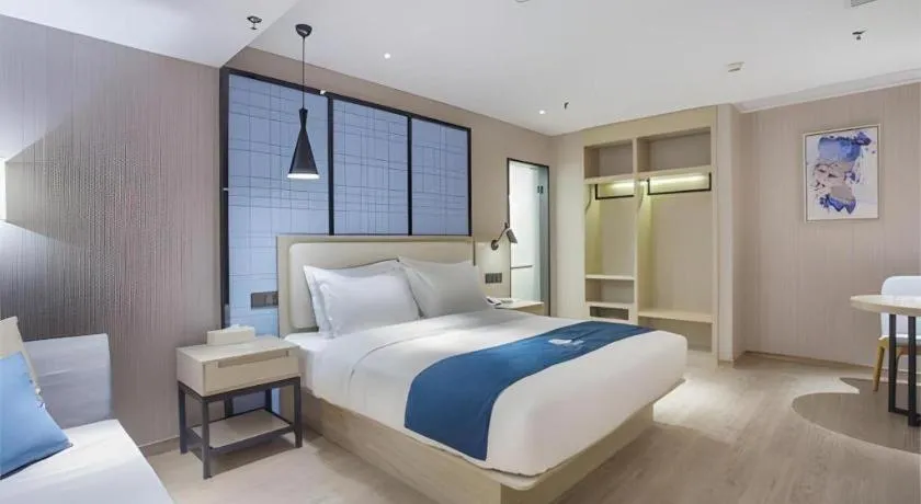 Bed in Echarm Hotel Xinyu Railway Station Baoshi Park