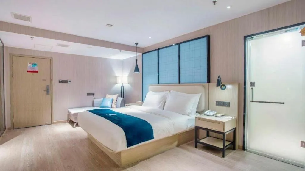 Bed in Echarm Hotel Xinyu Railway Station Baoshi Park