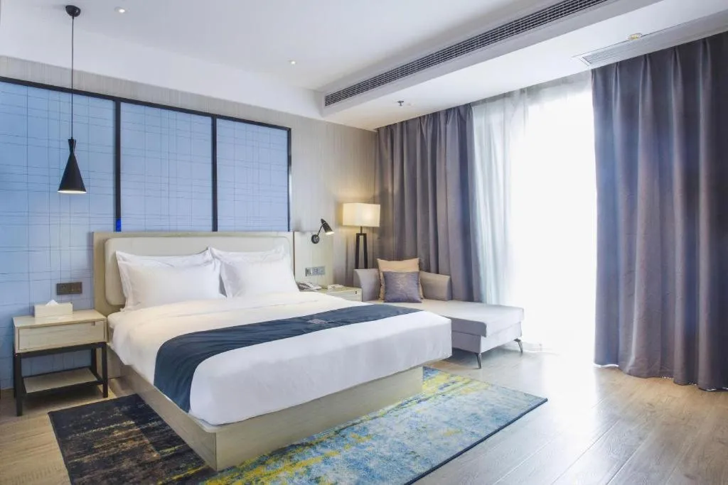 Bed in Echarm Hotel Xinyu Railway Station Baoshi Park