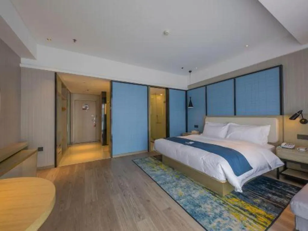 Bed in Echarm Hotel Xinyu Railway Station Baoshi Park