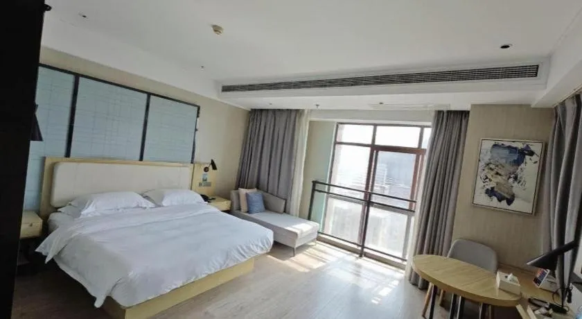 Bed in Echarm Hotel Xinyu Railway Station Baoshi Park