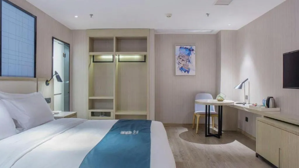 Bed in Echarm Hotel Xinyu Railway Station Baoshi Park