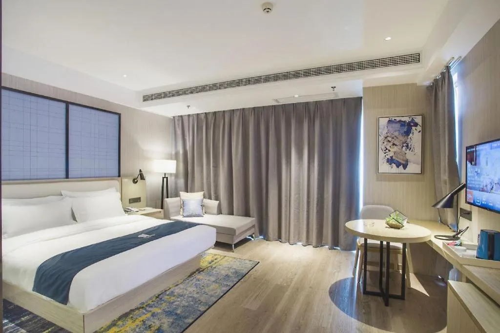 Bed in Echarm Hotel Xinyu Railway Station Baoshi Park