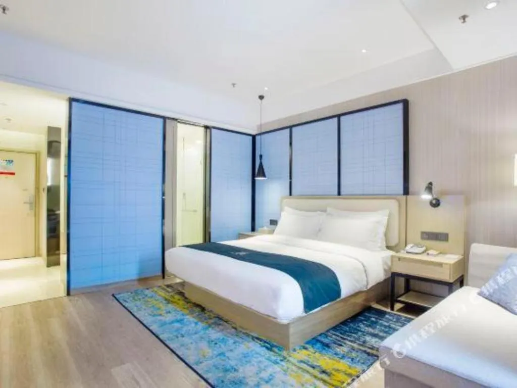 Bed in Echarm Hotel Xinyu Railway Station Baoshi Park