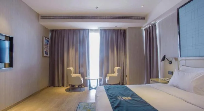 Bed in Echarm Hotel Xinyu Railway Station Baoshi Park