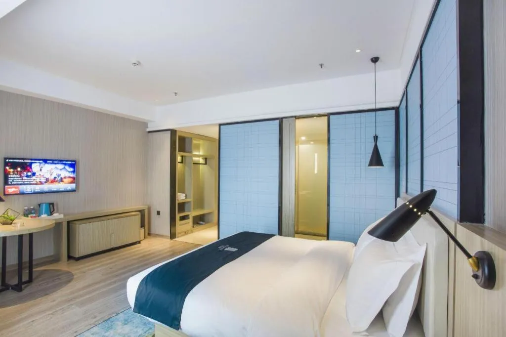 Bed in Echarm Hotel Xinyu Railway Station Baoshi Park