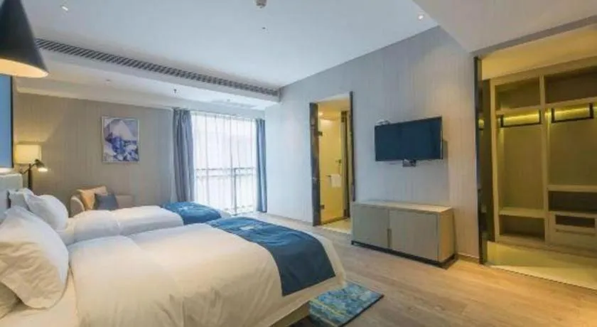 Bed in Echarm Hotel Xinyu Railway Station Baoshi Park