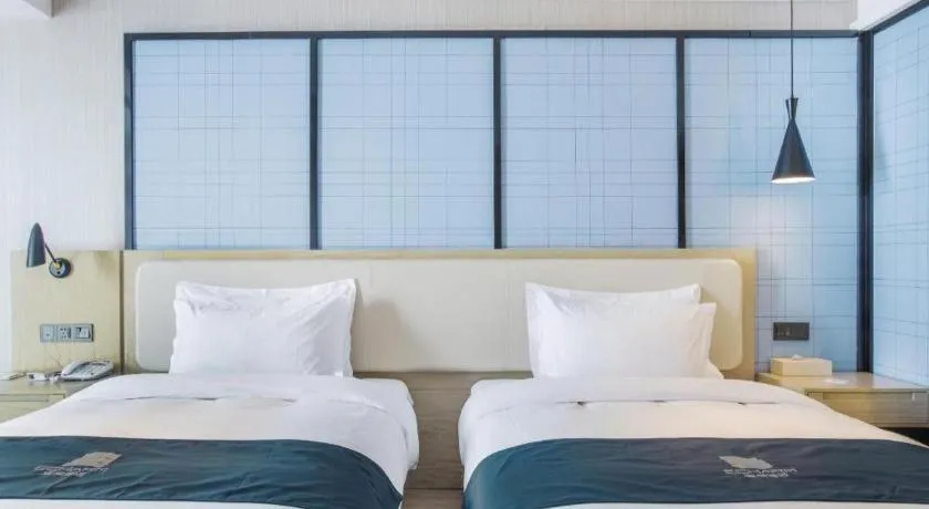 Bed in Echarm Hotel Xinyu Railway Station Baoshi Park