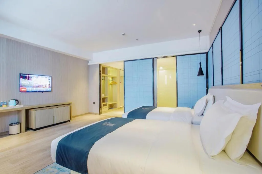 Bed in Echarm Hotel Xinyu Railway Station Baoshi Park