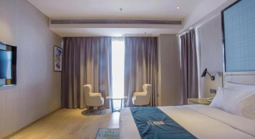 Bed in Echarm Hotel Xinyu Railway Station Baoshi Park