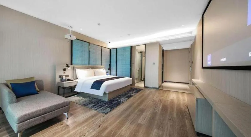 Bed in Echarm Hotel Xinyu Railway Station Baoshi Park